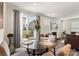 Bright dining area featuring a glass table, stylish chairs, and sliding glass doors to the outdoor area at 13327 Savaine St, Charlotte, NC 28278