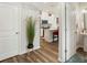 Open-concept floor plan leading to a modern kitchen with a center island at 13327 Savaine St, Charlotte, NC 28278