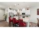 Bright kitchen with stainless steel appliances, quartz countertops, and a center island at 13327 Savaine St, Charlotte, NC 28278