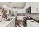 Modern kitchen features white cabinets, stainless steel appliances, and stylish countertops at 13327 Savaine St, Charlotte, NC 28278