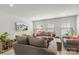 Spacious living room with comfortable gray sofas, a flatscreen television, and plenty of natural light at 13327 Savaine St, Charlotte, NC 28278