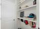 Functional mud room featuring built-in shelves, hooks, and storage baskets for organizing essentials at 13327 Savaine St, Charlotte, NC 28278