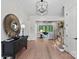 Elegant foyer showcasing hardwood floors, modern decor, and open access to living areas and staircase at 1405 Waxhaw Marvin Rd, Waxhaw, NC 28173