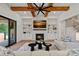 Cozy living room featuring a stone fireplace, built-in shelves, and a comfortable seating area at 1405 Waxhaw Marvin Rd, Waxhaw, NC 28173