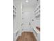 This mudroom features custom built-in storage with hooks and shelves, providing an organized and welcoming entry to the home at 1405 Waxhaw Marvin Rd, Waxhaw, NC 28173