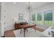 Well-lit office space with modern desk, custom shelving, and plantation shutters at 1405 Waxhaw Marvin Rd, Waxhaw, NC 28173