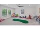 This playroom features carpeted floors, a ceiling fan, built in storage and plenty of toys for an imaginative play space at 1405 Waxhaw Marvin Rd, Waxhaw, NC 28173