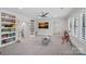Bright and spacious playroom with neutral carpet, built-in shelving, and plenty of room for activities and play at 1405 Waxhaw Marvin Rd, Waxhaw, NC 28173