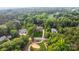 Aerial view of upscale homes and golf course surrounded by lush trees at 167 Quaker Rd, Mooresville, NC 28117