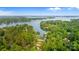 Breathtaking aerial view of a lake, golf course, and tree-lined properties at 167 Quaker Rd, Mooresville, NC 28117