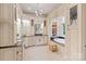 Luxurious bathroom with custom cabinets, granite counters, and soaking tub with decorative details at 167 Quaker Rd, Mooresville, NC 28117