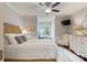 Bright bedroom with neutral colors, a ceiling fan, and a window seat at 167 Quaker Rd, Mooresville, NC 28117