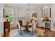 Cozy dining area with fireplace, wine bar, and natural light streaming in at 167 Quaker Rd, Mooresville, NC 28117