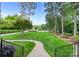 Beautifully landscaped front yard featuring lush green lawn and walkway leading to the home at 167 Quaker Rd, Mooresville, NC 28117