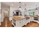 Gourmet kitchen featuring a large island, copper sink and stainless steel appliances at 167 Quaker Rd, Mooresville, NC 28117
