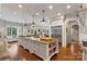 Open kitchen with a large island, granite countertops, and stainless steel appliances at 167 Quaker Rd, Mooresville, NC 28117