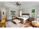 Spacious bedroom boasts trey ceilings, hardwood floors, and relaxing sitting area at 167 Quaker Rd, Mooresville, NC 28117