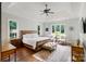 Serene bedroom with a trey ceiling, a large window, and hardwood floors at 167 Quaker Rd, Mooresville, NC 28117