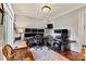 Home office with hardwood floors, large windows for natural light, and custom cabinets at 167 Quaker Rd, Mooresville, NC 28117