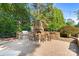 Custom outdoor kitchen with stone pizza oven, grill, and seating area is an entertainer's dream at 167 Quaker Rd, Mooresville, NC 28117
