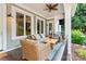 Relaxing covered porch with comfortable seating and a ceiling fan at 167 Quaker Rd, Mooresville, NC 28117