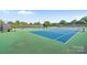 Well-maintained tennis courts surrounded by fencing and lush greenery at 167 Quaker Rd, Mooresville, NC 28117