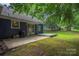 Backyard with a patio, lush greenery, and manicured lawn at 172 Valleybrook Dr # 8, Denver, NC 28037