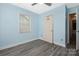 This bedroom features wood-look flooring, a window and a closet at 172 Valleybrook Dr # 8, Denver, NC 28037