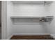 White walk-in closet with built-in shelving and hardwood floors at 172 Valleybrook Dr # 8, Denver, NC 28037