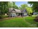 Charming home with a well-maintained lawn, stone walkway, and mature trees at 172 Valleybrook Dr # 8, Denver, NC 28037