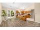 Bright kitchen featuring wood cabinets, a peninsula with seating, and sliding glass doors at 172 Valleybrook Dr # 8, Denver, NC 28037
