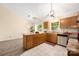 Well-lit kitchen featuring stainless steel appliances and a granite countertop peninsula at 172 Valleybrook Dr # 8, Denver, NC 28037