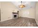 Cozy living room featuring a fireplace, wood floors, and neutral paint at 172 Valleybrook Dr # 8, Denver, NC 28037