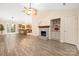 Open living area with wood floors, a fireplace, and seamless flow to the kitchen at 172 Valleybrook Dr # 8, Denver, NC 28037
