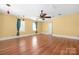 Bright and airy living room with hardwood floors, natural light, and modern ceiling fan at 172 Valleybrook Dr # 8, Denver, NC 28037