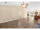 Spacious living room with high ceilings, wood floors, and a view to the kitchen at 172 Valleybrook Dr # 8, Denver, NC 28037