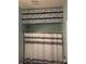 Bathroom with striped shower curtain and floral storage box at 19157 Mallard Dr, Fort Mill, SC 29707