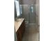 Bathroom with a double sink vanity, framed mirror, and shower behind framed glass doors at 19157 Mallard Dr, Fort Mill, SC 29707