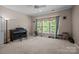 Spacious bedroom with carpet flooring, a ceiling fan, and large windows at 19157 Mallard Dr, Fort Mill, SC 29707