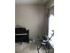Carpeted music room with a Yamaha keyboard and accordion next to the window with neutral colored walls at 19157 Mallard Dr, Fort Mill, SC 29707