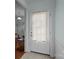 Entryway door with side panels and neutral paint, opening up to a view of the rest of the house at 19157 Mallard Dr, Fort Mill, SC 29707