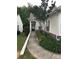 Inviting front entrance with a well-manicured lawn, trimmed bushes, and an elegant black front door at 19157 Mallard Dr, Fort Mill, SC 29707