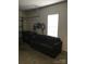 Spacious garage with cement floor, black sofa, and closed garage door at 19157 Mallard Dr, Fort Mill, SC 29707