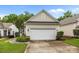 Attached one car garage with siding, black gutters, fresh landscaping, and concrete drive at 19157 Mallard Dr, Fort Mill, SC 29707