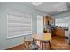 Cozy eat-in kitchen area features a round wooden table and a bright, sunlit window at 19157 Mallard Dr, Fort Mill, SC 29707