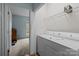 Convenient laundry area with washer, dryer, and wire shelving, next to another room at 19157 Mallard Dr, Fort Mill, SC 29707