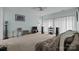 Inviting living room with plush carpeting, a ceiling fan, a comfortable couch, and large windows at 19157 Mallard Dr, Fort Mill, SC 29707
