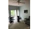Cozy living room with door to balcony, neutral carpet, and bright walls at 19157 Mallard Dr, Fort Mill, SC 29707