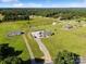 Aerial view showcasing a blue home with outbuildings, large yard and beautiful countryside at 2268 Westbrook Rd, Edgemoor, SC 29712