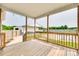 Comfortable outdoor porch looking out to a large backyard and in-ground pool at 2268 Westbrook Rd, Edgemoor, SC 29712